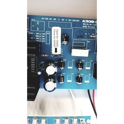 Blue altronix smp5ctx high current power supply circuit board with black and white electronic components visible
