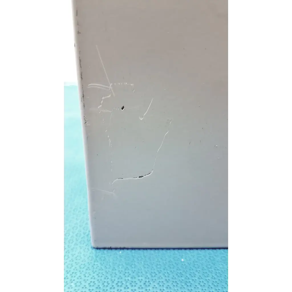 A light gray rectangular altronix smp5ctx high current power supply charger with minor scratches and a small dark spot