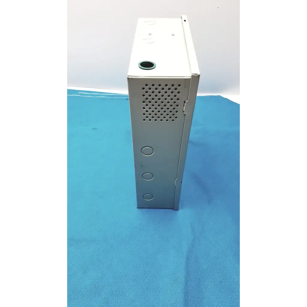 Silver metallic altronix smp5ctx high current power supply charger with perforated side panel and circular mounting holes