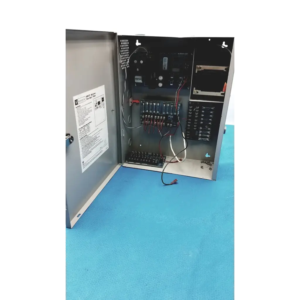 Gray metal electrical control panel showing wiring and circuitry inside of altronix smp5ctx high current power supply