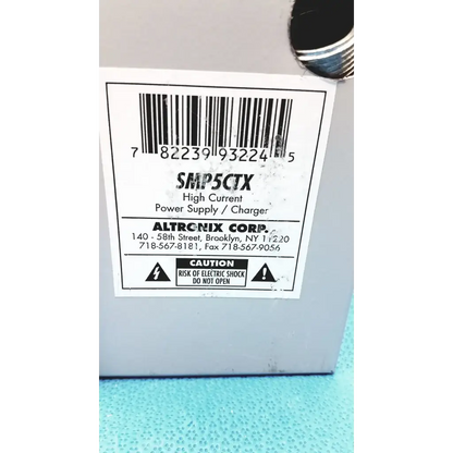 Gray plastic altronix smp5ctx high current power supply charger with white label and barcode for 12vdc 24vdc use