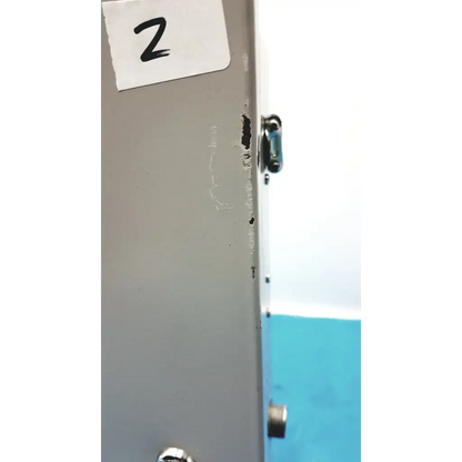 Gray metal cabinet of altronix smp5ctx high current power supply with small black latch and visible side scratches