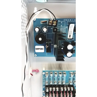 Blue smp5bc circuit board with white knobs and labeled components in altronix smp5ctx high current power supply charger