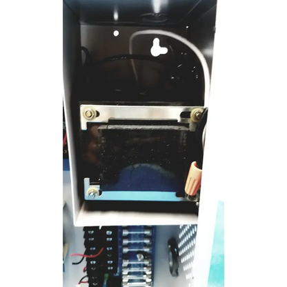 Black rectangular altronix smp5ctx high current power supply with metallic brackets and wiring inside white enclosure