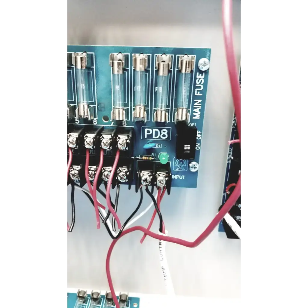 Blue Altronix SMP5CTX high current power supply circuit board with clear glass fuses and labeled terminals visible