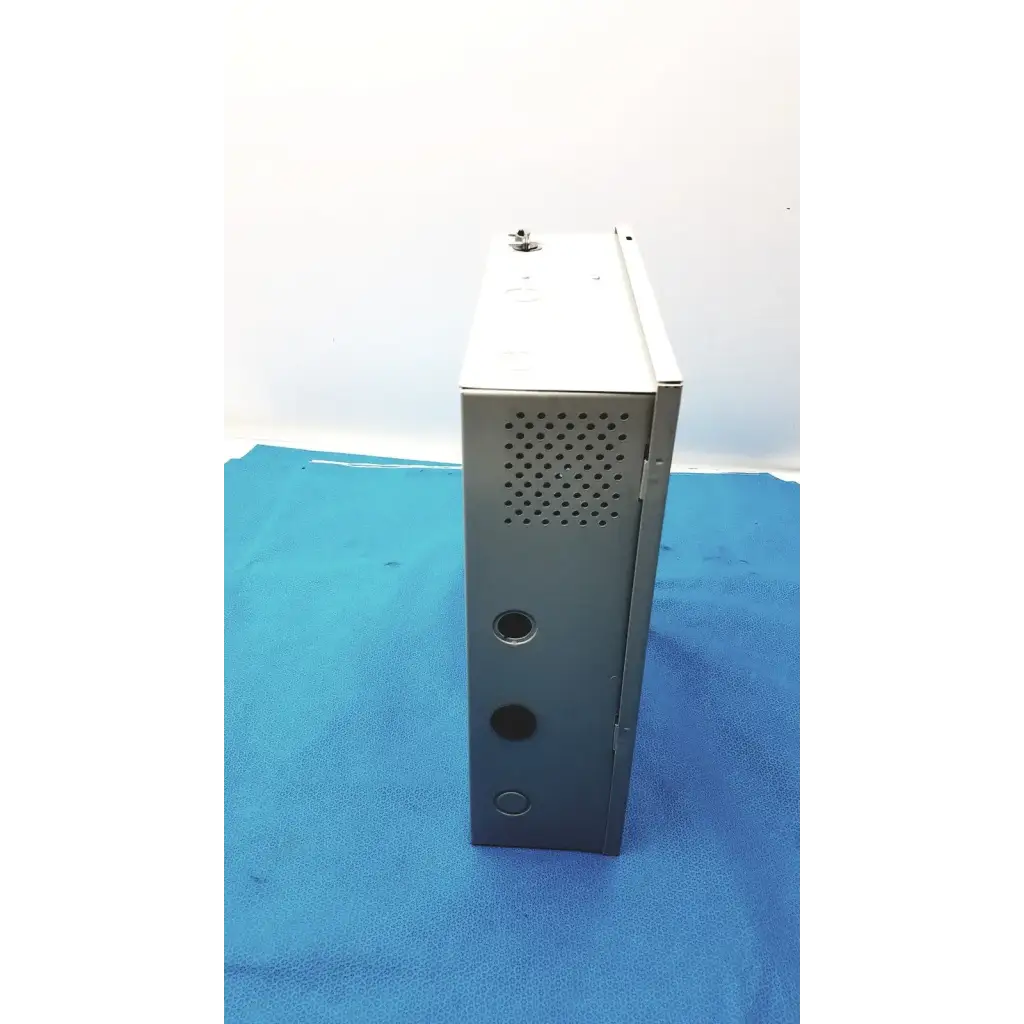 Gray metal server rack with perforated ventilation panel and mounting holes on the back of altronix smp5ctx power supply