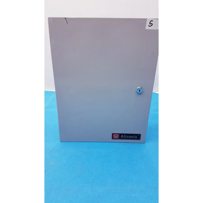 Gray metal altronix smp5ctx power supply enclosure with keyed lock and label for 12VDC or 24VDC use