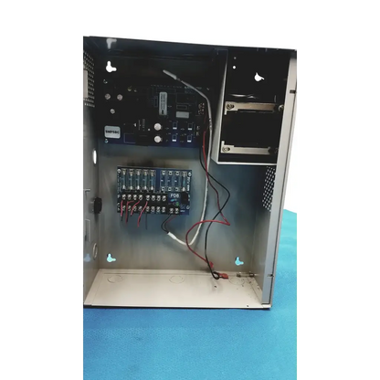 Black metal altronix smp5ctx power supply with visible internal circuit boards and wiring for 12vdc or 24vdc use