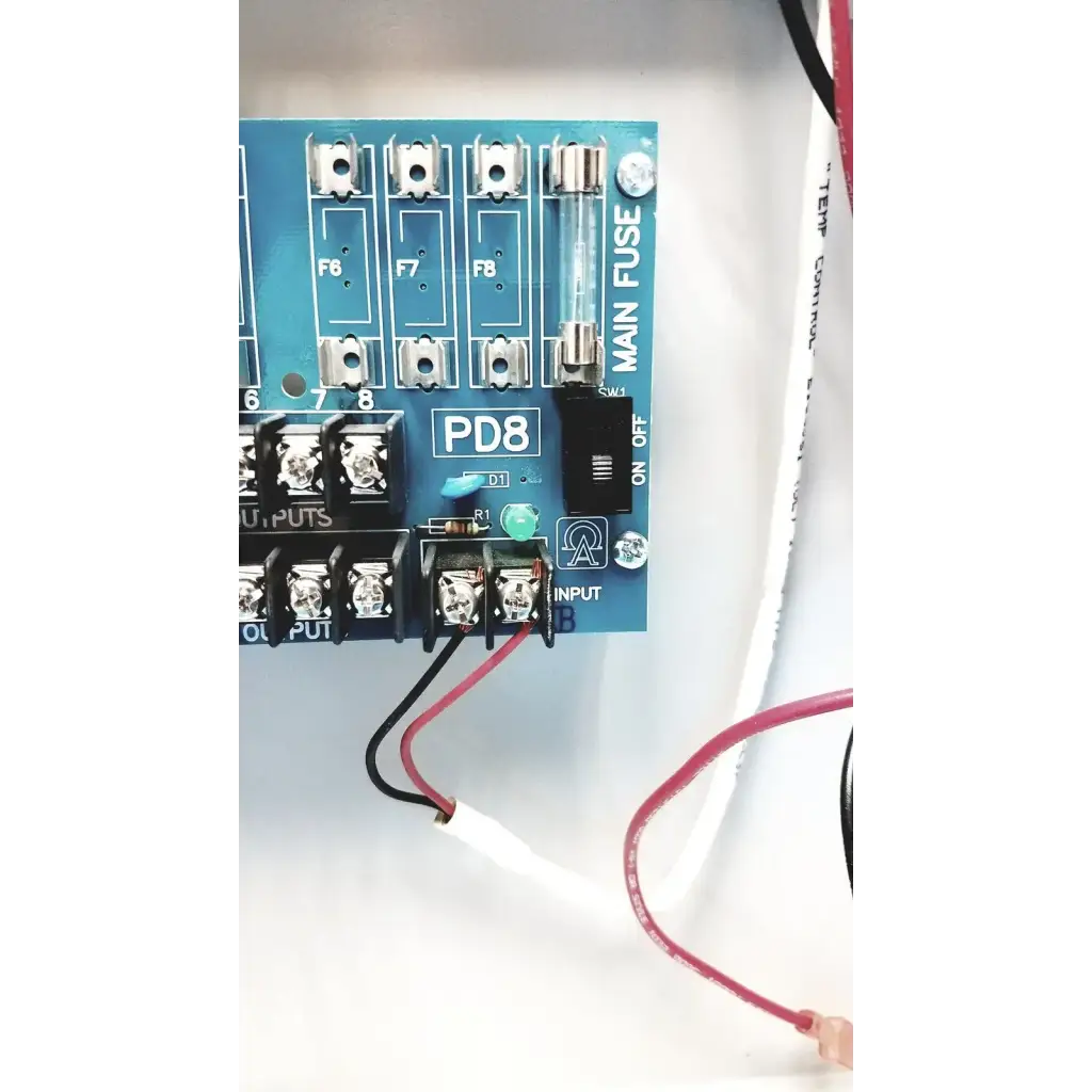 Blue pd8 power distribution board with silver terminal blocks and labeled fuse slots on altronix smp5ctx power supply