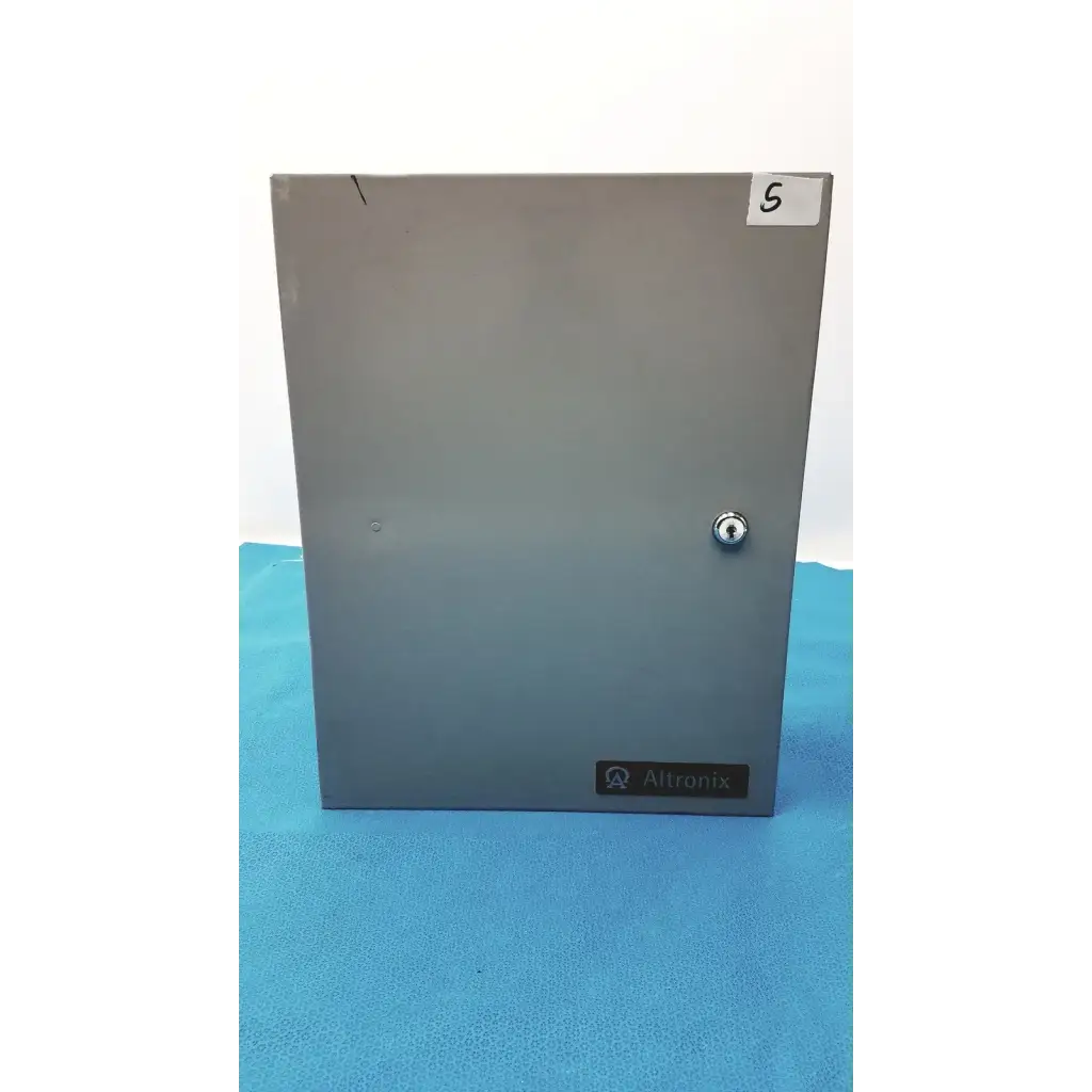 Gray metal altronix smp5ctx power supply enclosure with keyhole and label for 12vdc or 24vdc power supply