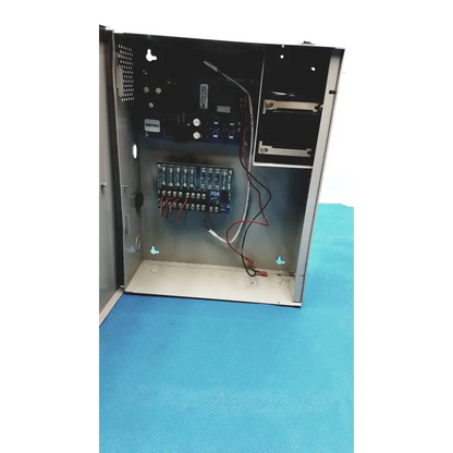 Metallic gray industrial control panel showing wiring and circuit boards inside for altronix smp5ctx power supply