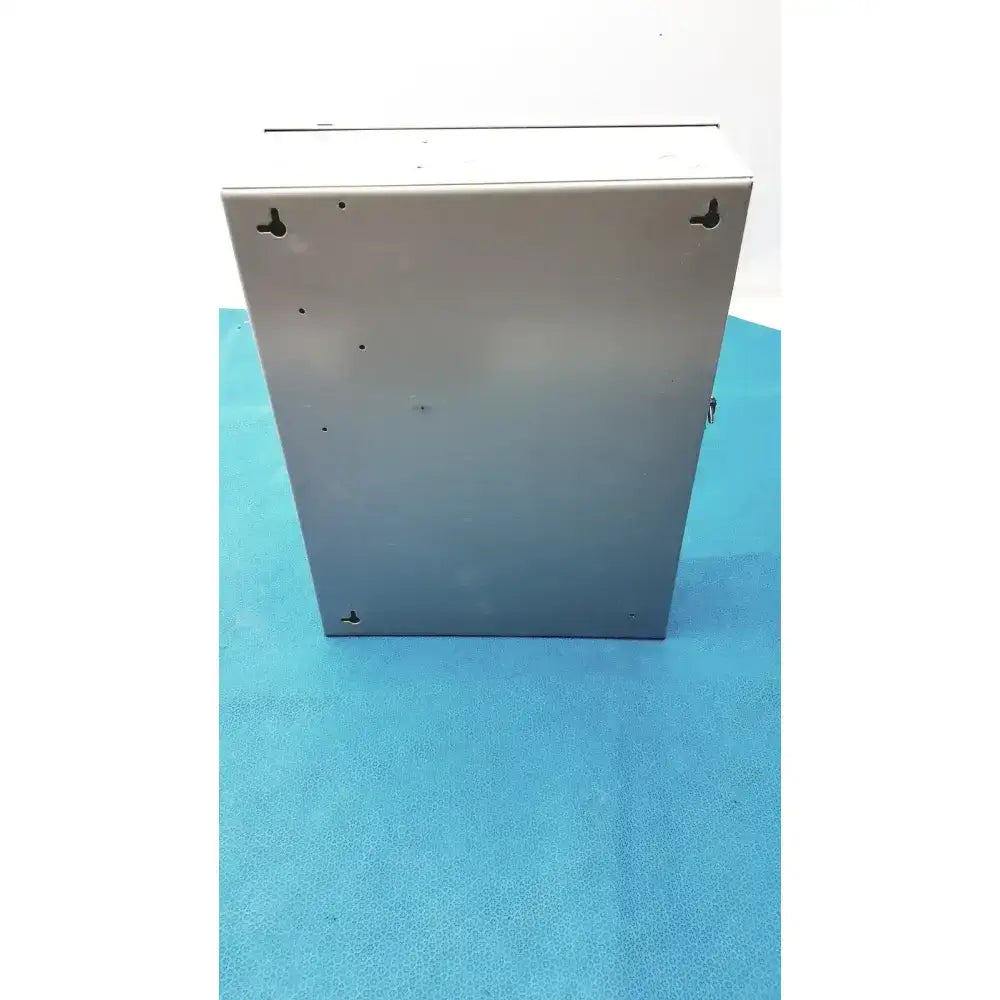 Silver metallic industrial enclosure of altronix smp7-ctx high current power supply with mounting holes at corners