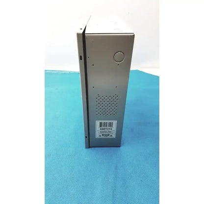 Silver metallic smp7-ctx high current power supply with perforated ventilation panel and barcode label