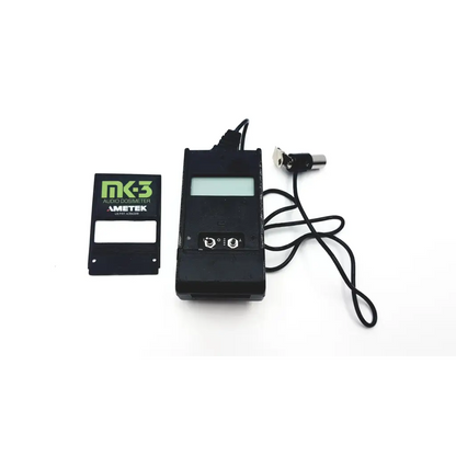 Black ametek audio dosimeter mk3 with digital display and attached cable in acoustical calibrator ac-94 plus case