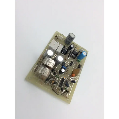 A beige amrex swept galvo rev c board with capacitors resistors and integrated circuits on a printed circuit board