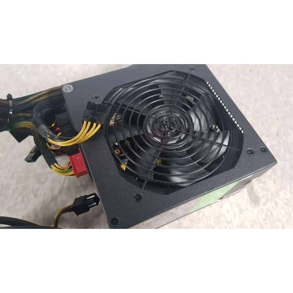 Black rectangular computer power supply unit with circular fan and cables in the antec truepower 550w black model