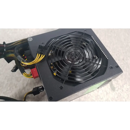 Black rectangular computer power supply unit with circular fan and cables in the antec truepower 550w black model