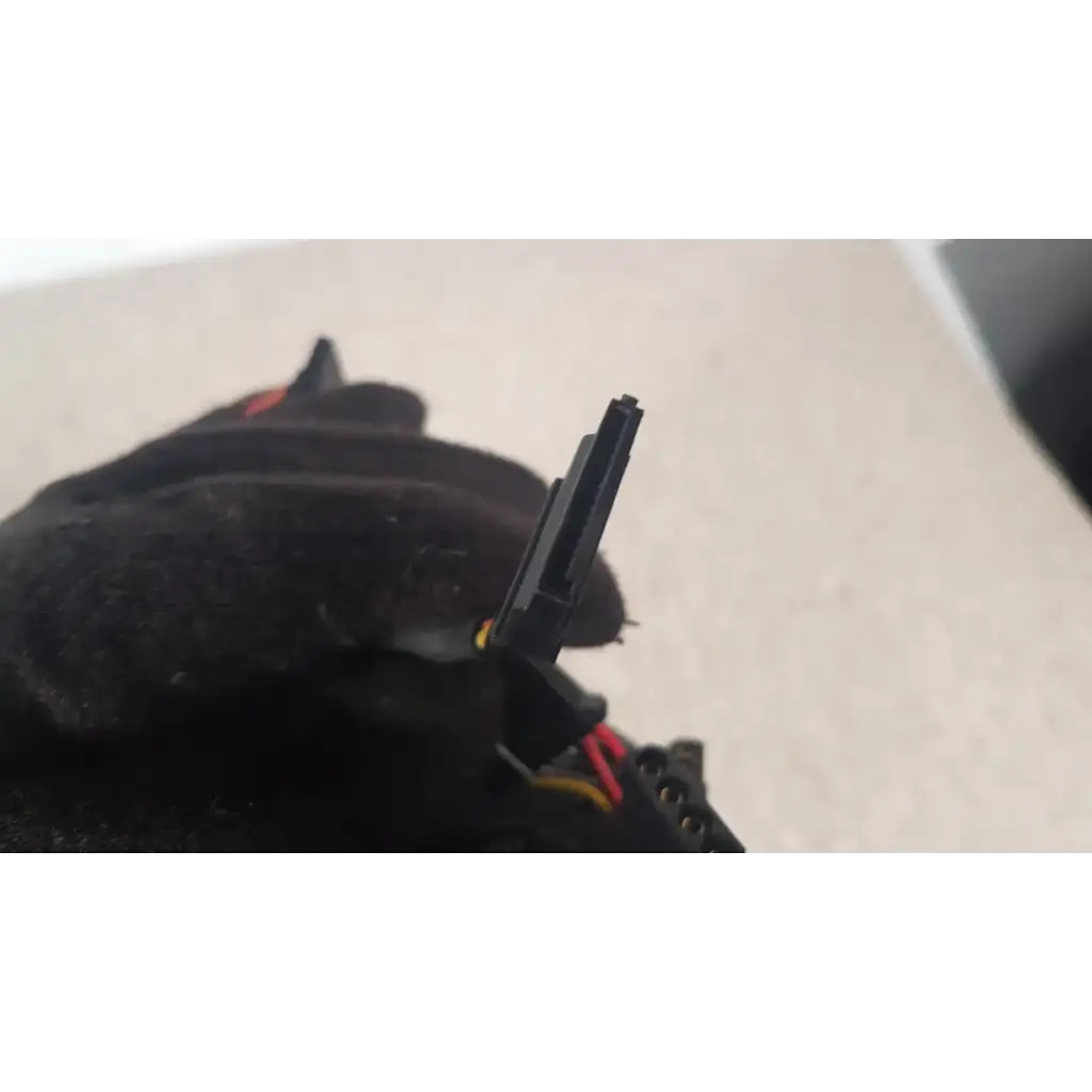 Black plastic sata power connector with red and yellow wires attached to antec truepower 550w black switching power supply