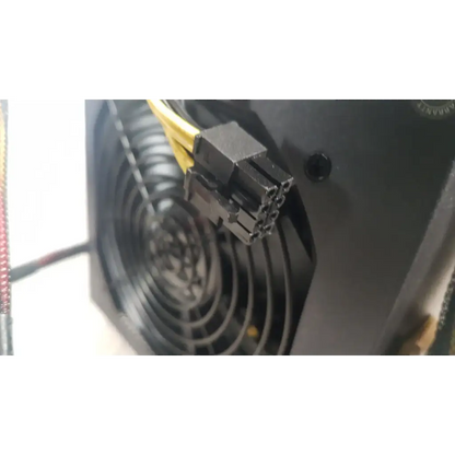 Black plastic 8-pin power connector with yellow cables on the back of the antec truepower 550w black switching power supply