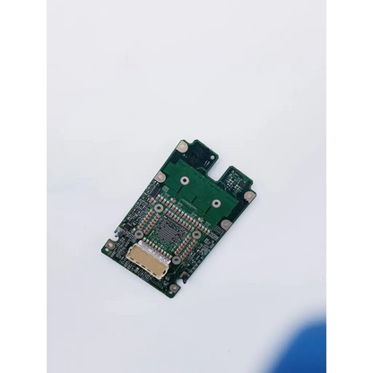Green rectangular Apple PowerMac G5 Server CPU processor board with silver solder points and central microchip for nibp assembly board