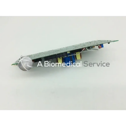 Silver spherical component on green circuit board with colored capacitors in applied biosystems tec n8059024 rev system