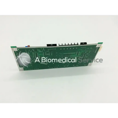 Green circuit board with silver metallic edges and white circular logo on the left side for applied biosystems tec n8059024 rev