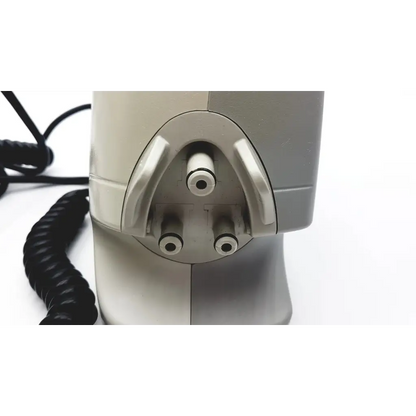Gray plastic arjo-huntleigh 630003 auto logic pressure pump with three circular ports and coiled black cable visible