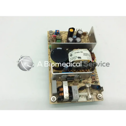 Brown circuit board with black silver components and heat sink in artesyn 510132 open frame power supply