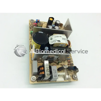 Artesyn 510132 brown open frame power supply with black and silver capacitors resistors and coils mounted on it