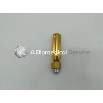 Gold-colored arthrex ar-1415 cannulated jacobs chuck handle with textured grip and metallic chuck for surgical drilling