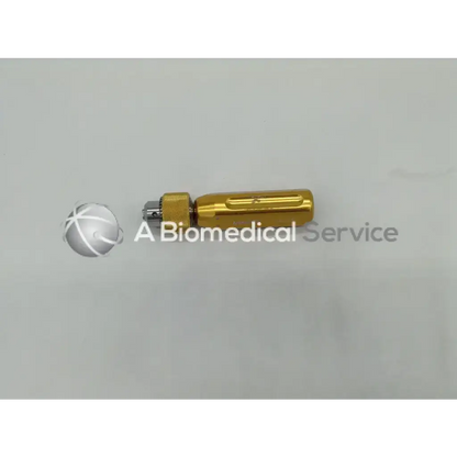 Gold-colored Arthrex AR-1415 cannulated jacobs chuck handle with textured grip and metallic tip for surgical use