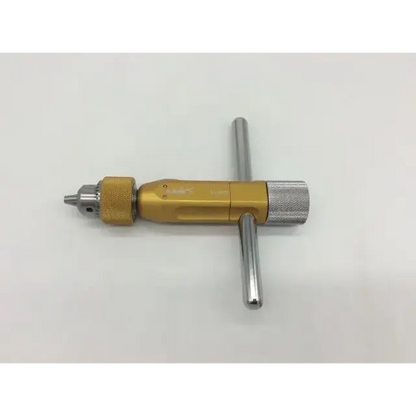 Gold-colored metal drill chuck with silver textured grip handle for arthrex ar-1415t tube harvester driver extractor