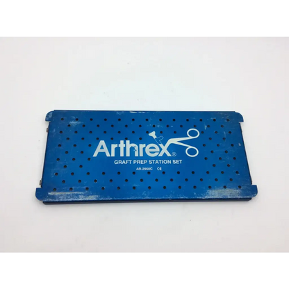 Blue perforated metal arthrex graft prep station set with white logo for efficient graft prep and organization