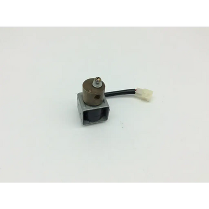 Asco uft8262c2mo brown cylindrical solenoid valve with black wire and white connector mounted on metallic base