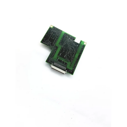 Green ascom 4-0694-9500 converter board with black traces and a white connector on printed circuit board