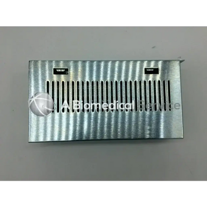 Silver corrugated metal ventilation grille with vertical slats and cutouts for asp sterrad rev b distribution assy