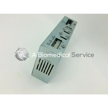 Silver metallic rectangular asp sterrad rev b distribution power supply unit with labeled ports and ventilation slots back side