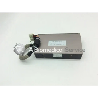 Gray rectangular asp sterrad nx rev c power supply unit with silver spherical connector and black cable