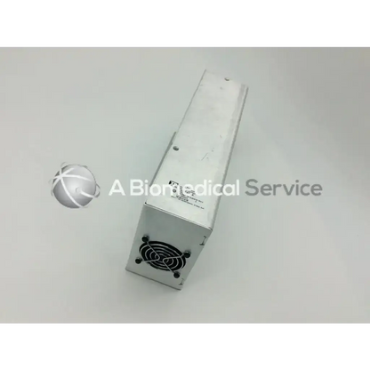 Silver metallic rectangular asp sterrad nx power supply rev g with black ventilated grille on one side