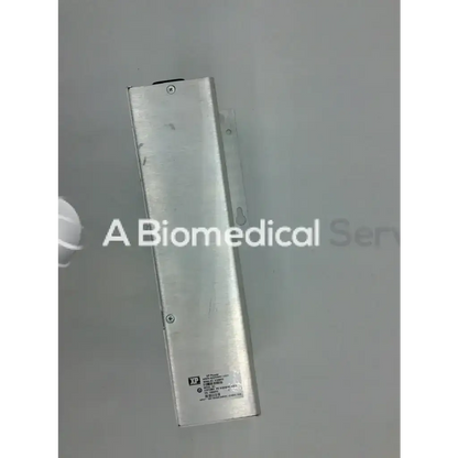 Silver rectangular metal asp sterrad nx power supply 40-52154-001 with label and screws on its surface
