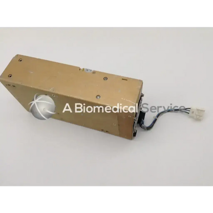 Brown rectangular astec mo4-2q-1e-0m power supply with silver circular component and black cable extending from one end