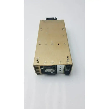 Gold-colored metal modular power supply astec mp6-3l-4nn-0m showing back side with ventilation and connection ports