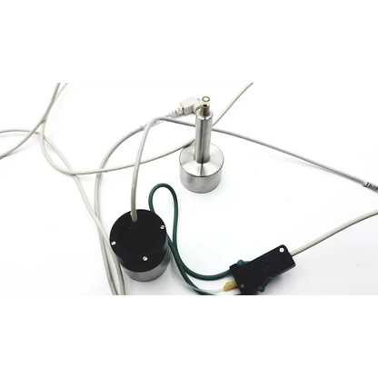 Silver cylindrical sensor with black base and cables in audioscan verifit model vf-1 hearing aid analyzer