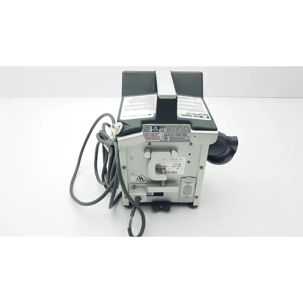 Gray and black industrial-grade air compressor with coiled power cord for Augustine Medical Bair patient warming unit