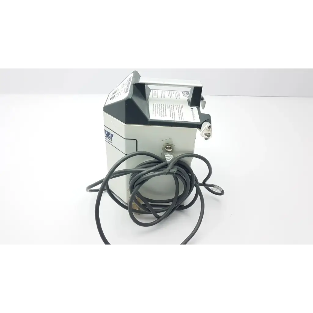 Gray and black industrial printer with coiled black cable on the backside of augustine medical bair hugger 505 patient warming unit