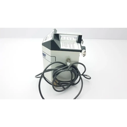Gray and black industrial printer with coiled black cable on the backside of augustine medical bair hugger 505 patient warming unit