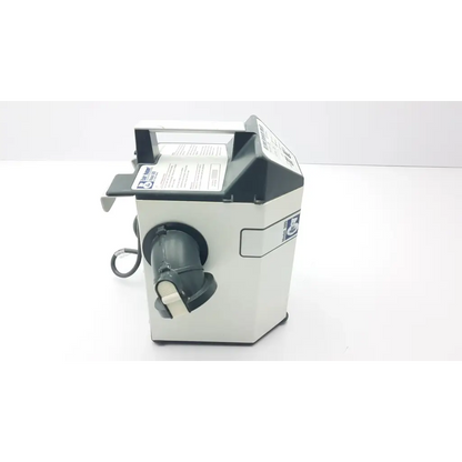 White and black countertop money counting machine with a handle on top adjacent to augustine medical bair hugger 505 patient warming unit