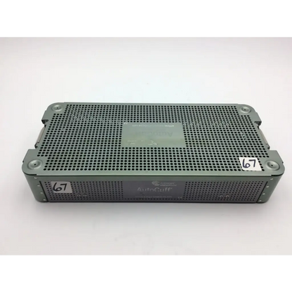 Gray perforated metal surgical instrument tray with autocuff branding from autocuff opus collection shoulder case