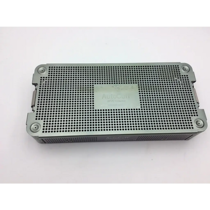 Gray perforated metal surgical instrument tray with reinforced corners in autocuff opus collection shoulder instrument case