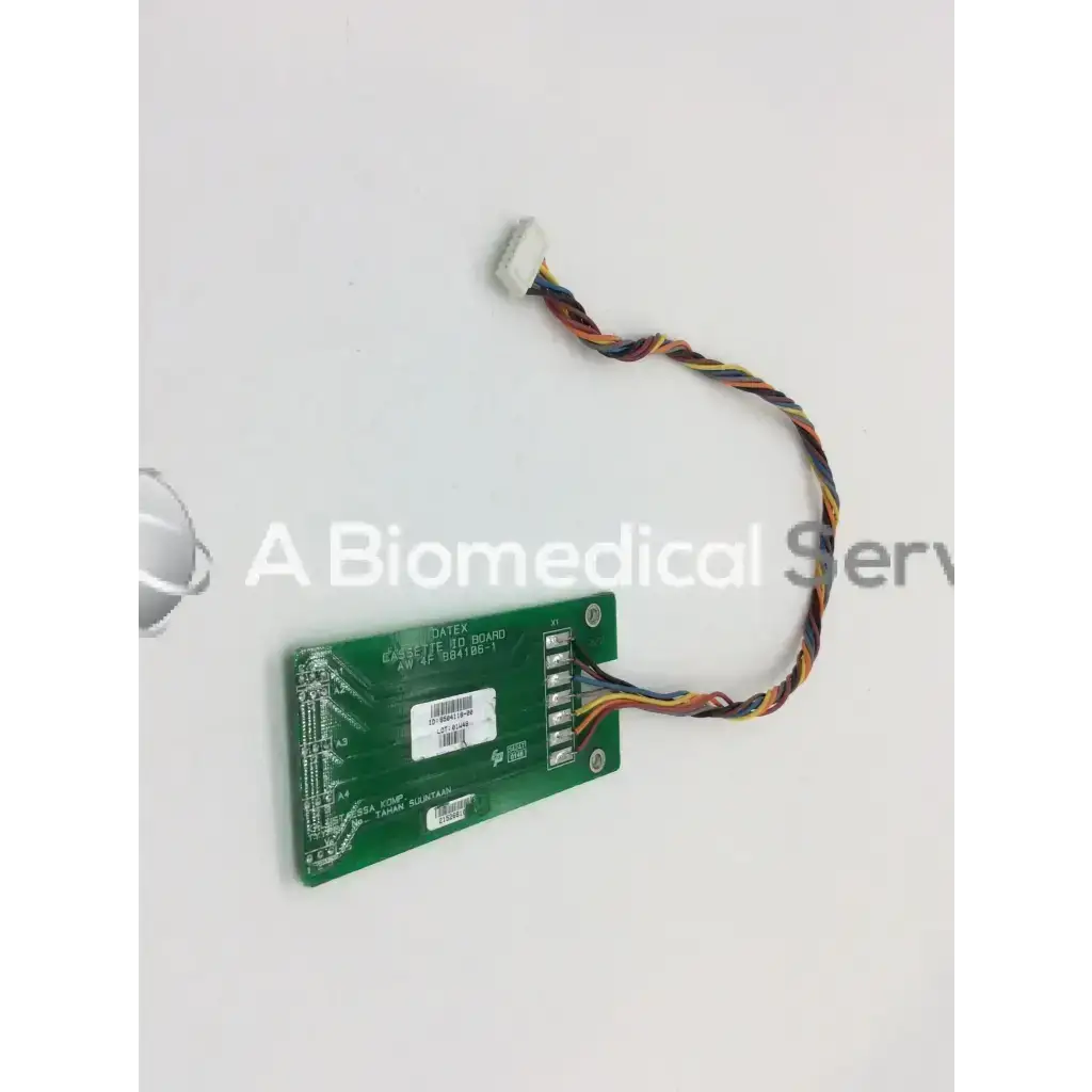 Green rectangular cassette id board with multicolored twisted wires and white connector for datex cassette bbcf5-11
